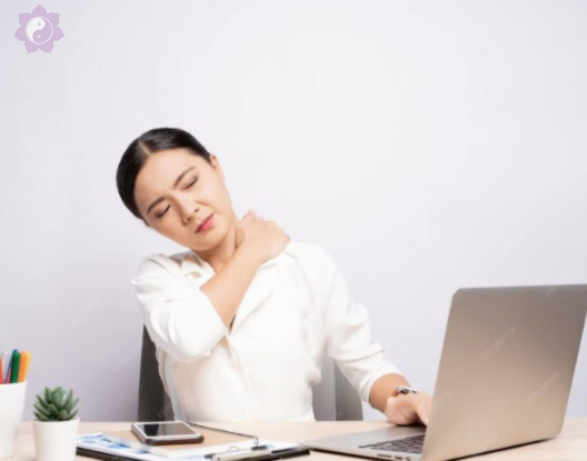 Woman holding her neck in pain, a common sign she may benefit from acupuncture for neck pain relief