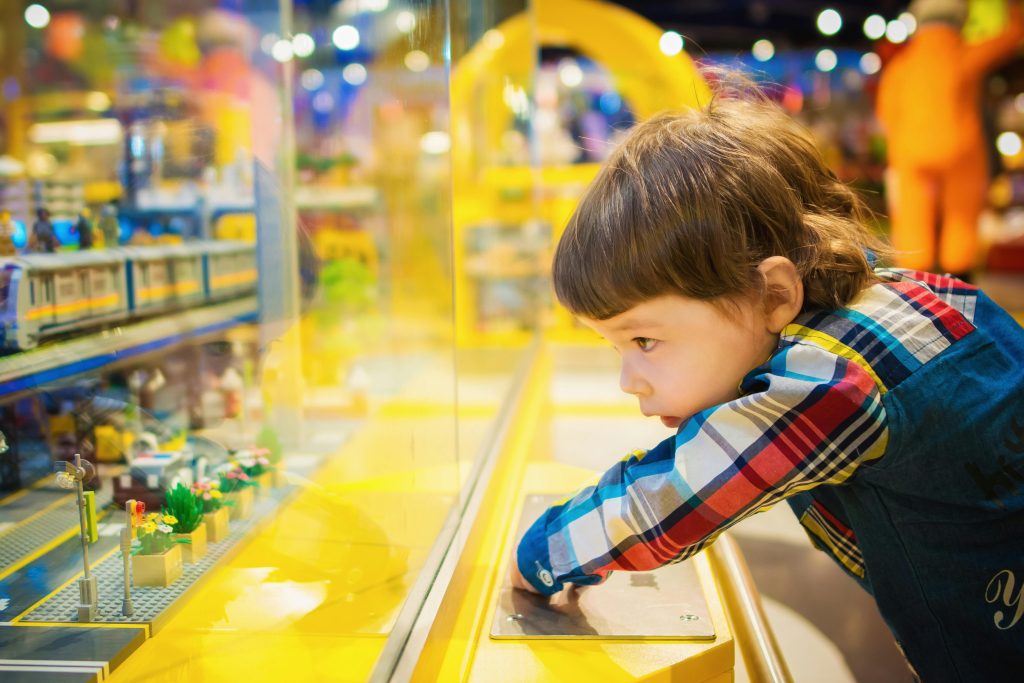 child looking at toys